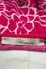 Pink floral patterned fabric with a Blumarine label on a mannequin.