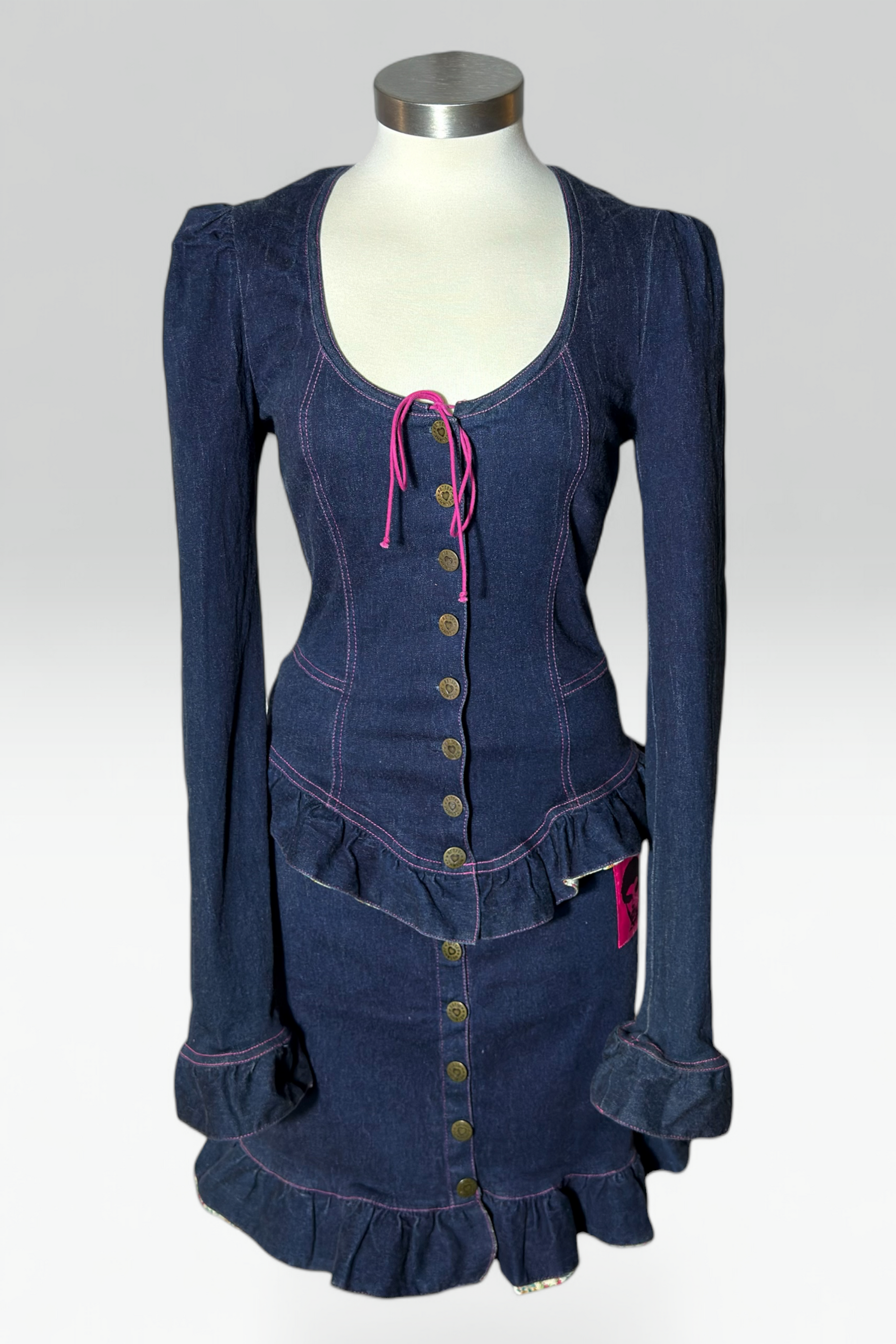 Coming soon: Betsey Johnson Betsey Johnson Pink Stitch Ruffle Dark Denim Skirt Set | American Vintage
