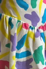 Colorful patterned skirt with a plain background