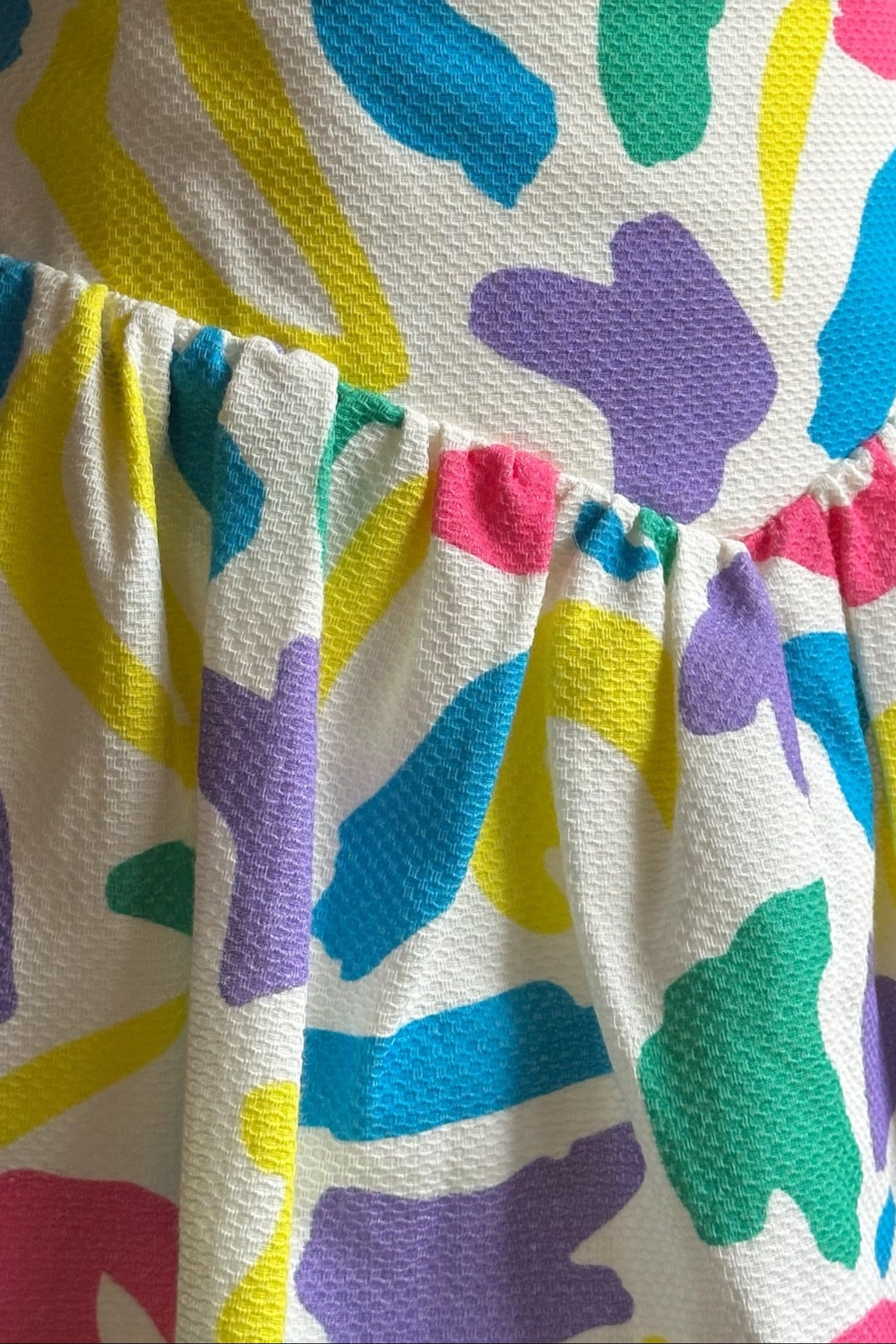 Colorful patterned skirt with a plain background